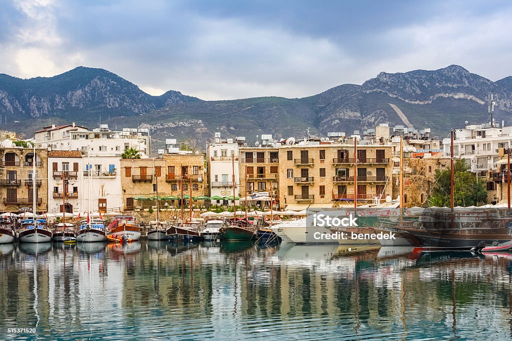 Kyrenia Northern Cyprus Harbor and Waterfront Photo of the waterfront and harbour with sailboats in Kyrenia, Northern Cyprus with mountains in the background. Republic Of Cyprus Stock Photo