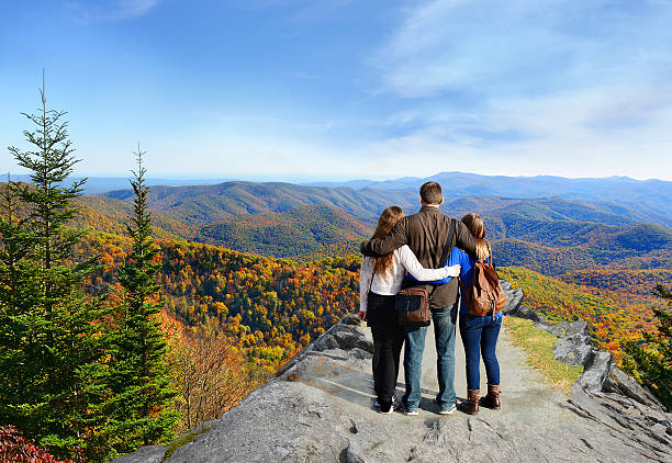 istock Family hiking in autumn mountains. 515374630