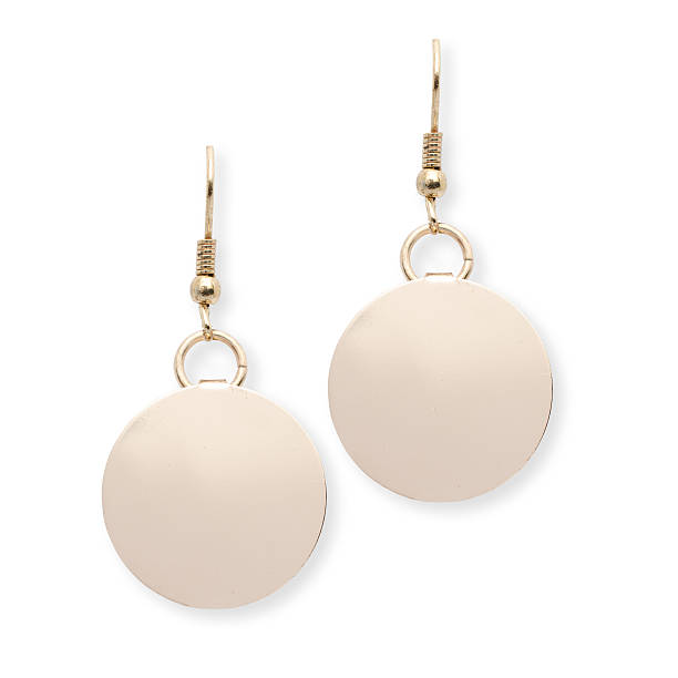 istock Round gold earrings isolated on a white 515374924