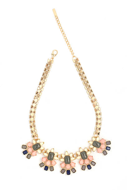 istock gold necklace with pink stones isolated on white 515376966
