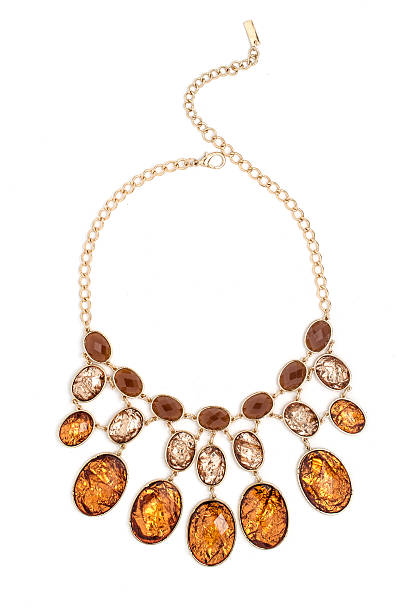 istock gold necklace with gems isolated on white 515377432