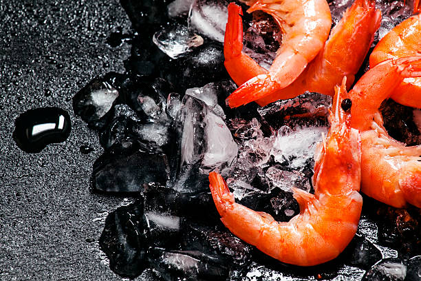 istock Food background, frozen cooked shrimp with ice 515377640