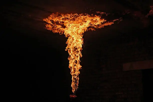 Photo of Fire artist performing fire breathing