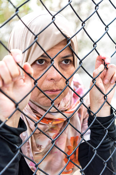 istock Sad refugee Middle eastern woman (Real People) 515380750