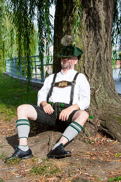 bavarian homem dormindo - men hat leather senior adult - fotografias e filmes do acervo