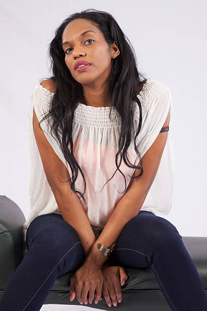 istock black woman sitting and smiling 515399171