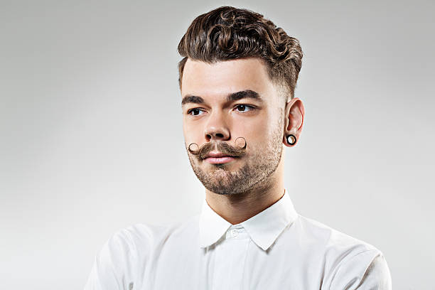 istock young hipster with moustaches and styled hair 515399631