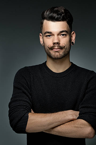 istock young hipster with moustaches and styled hair 515399635