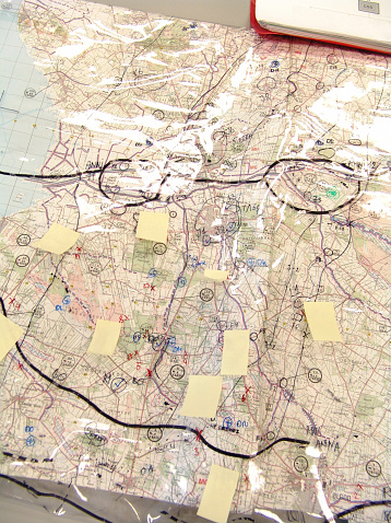 A closeup image of a map with markings and directions on it