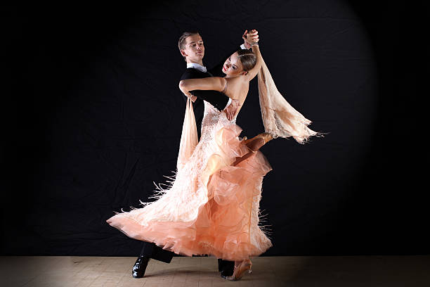 istock Latino dancers in ballroom against on black 515400477