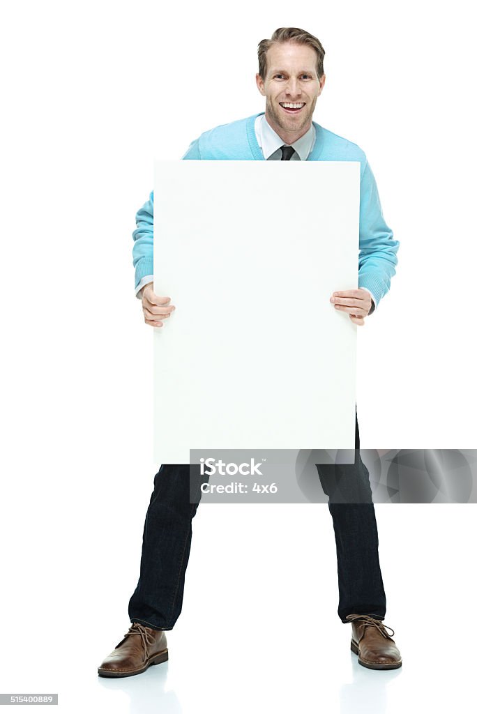 Cheerful man holding placard showing Cheerful man holding placard showinghttp://www.twodozendesign.info/i/1.png 40-44 Years Stock Photo