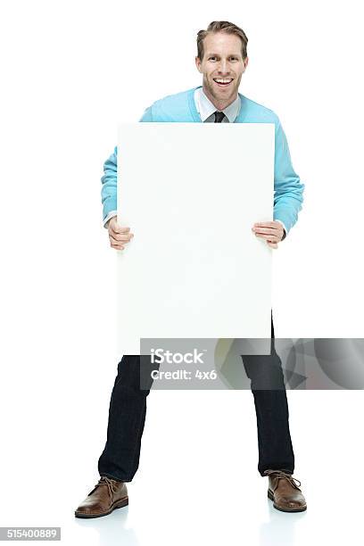 Cheerful Man Holding Placard Showing Stock Photo - Download Image Now - 40-44 Years, 40-49 Years, Adult