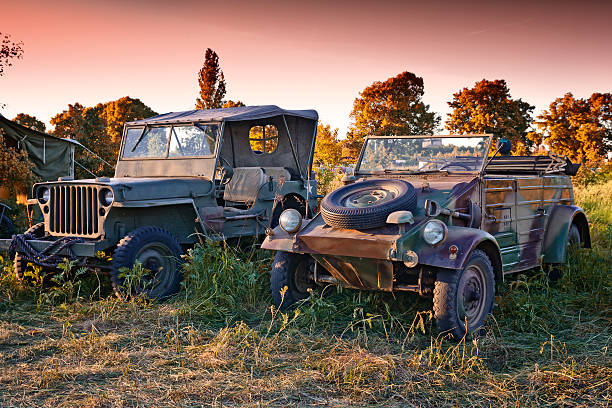 Vehicles on the field in sunset