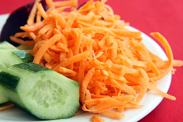 istock healthy vegetarian meal: carrots and cucumber 515433100