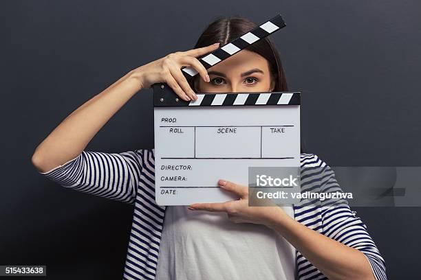 Handsome Girl With Clapperboard Stock Photo - Download Image Now - Movie, Film Slate, Film Industry