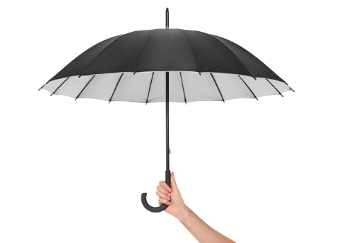 Hand holding black umbrella isolated on white, clipping path included