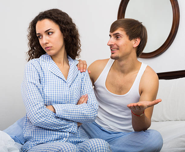 istock Smiling husband trying to reconcile with wife 515436000