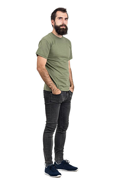 istock Serious bearded man with hands in pockets looking at camera 515436418