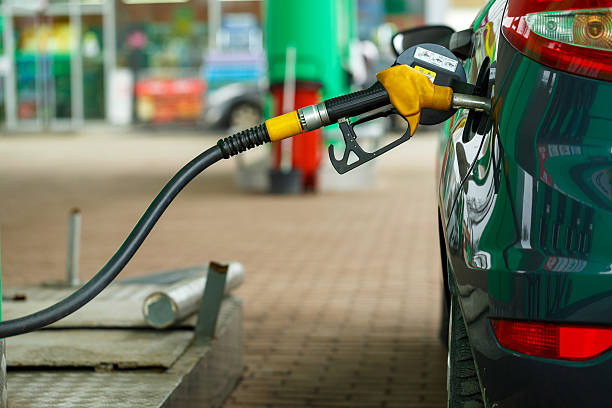 Car refueling on a petrol station Car refueling on a petrol station closeup benzine stock pictures, royalty-free photos & images