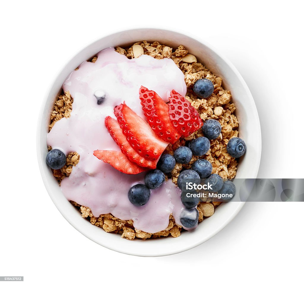 bowl of granola with yogurt and berries bowl of granola with yogurt and berries isolated on white background, top view Yogurt Stock Photo