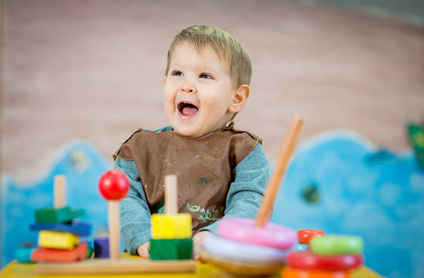 istock Kid is playing with toys in nursery 515437670