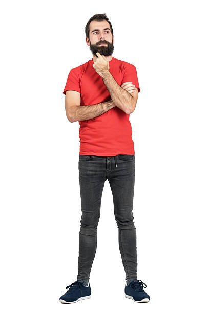 istock Bearded hipster thinking and touching his beard looking away. 515437930