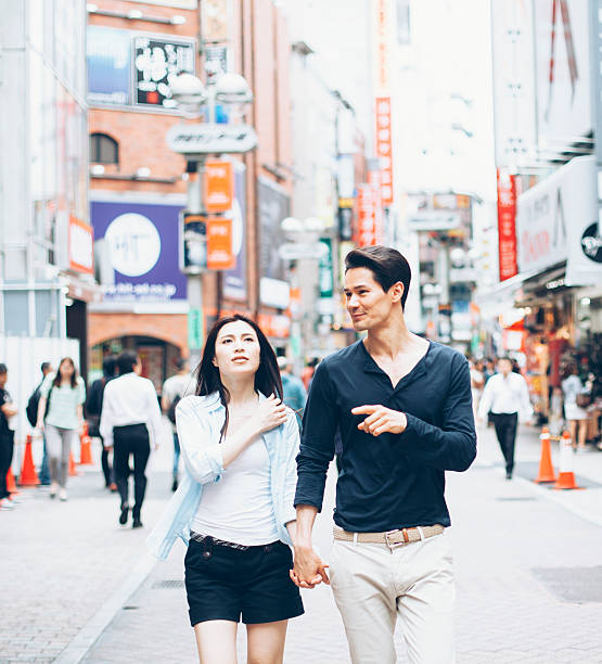 istock Young couple against cityscape background 515438872