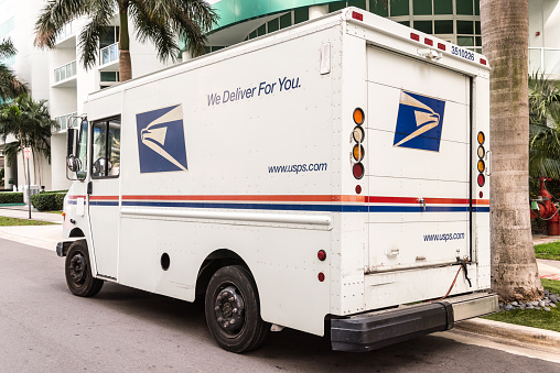 Miami, florida, usa - July 24, 2015: United States Post Office mail truck (USPS) parked in Miami, Florida