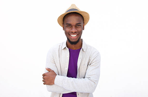 istock Cool young man standing with arms crossed 515440532