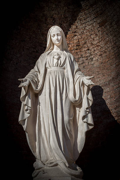 istock White stone statue of saint Mary 515443432