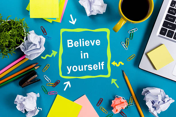 istock Believe in yourself. Office table desk with supplies, white blank 515443884