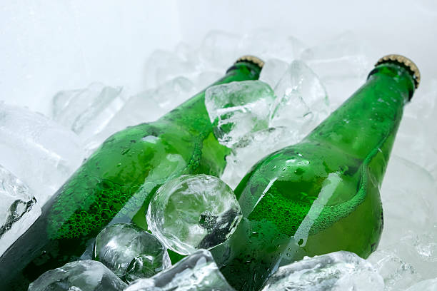 istock twin beer bottle in the ice on white 515444286