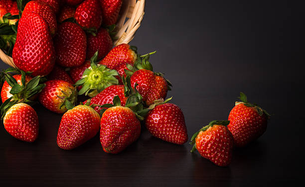 istock Fresh red strawberries in a wooden bowl 515446236