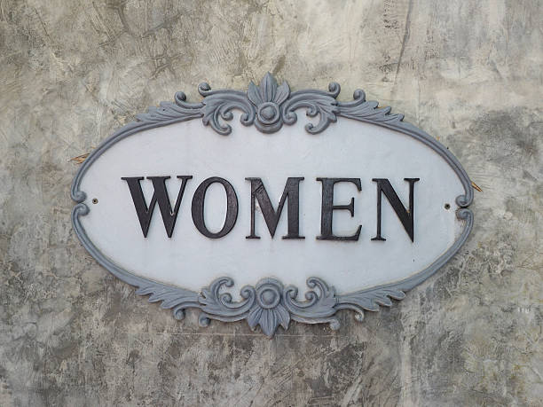 istock Women sign in vintage frame on exposed concrete wall 515447806