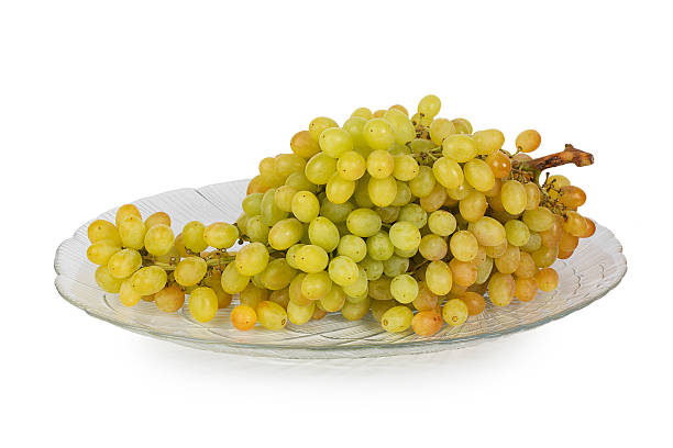 istock Bunch of green grapes on a glass plate 515450459