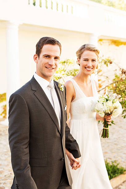istock Happy Bride And Groom Holding Hands 515450859