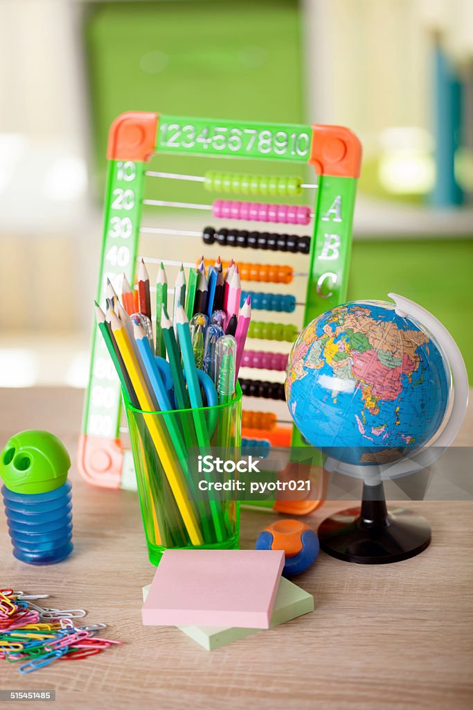 abacus,globe, books and pencils on table,back to school Globe, notebook stack and pencils. Schoolchild and student studies accessories Abacus Stock Photo