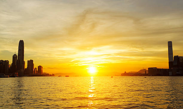 Sunset in Hong Kong Sunset in Hong Kong international commerce center stock pictures, royalty-free photos & images