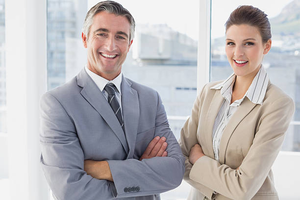 istock Business man and woman smiling 515452409