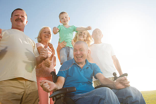 istock Disabled Man with family outside. 515454573