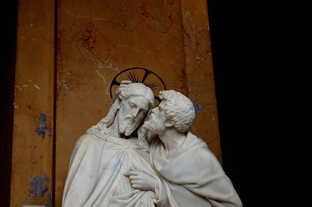 Betrayal: Judas kissing Jesus Judas kissing Jesus, by Ignazio Jacometti (1854). The sculpture is located in the chapel of St. Lawrence, where the Holy Stairs (Scala Sancta) is placed, nearby the Saint John at Lateran Church. The chapel also hosts the Sancta Sanctorum. judas stock pictures, royalty-free photos & images