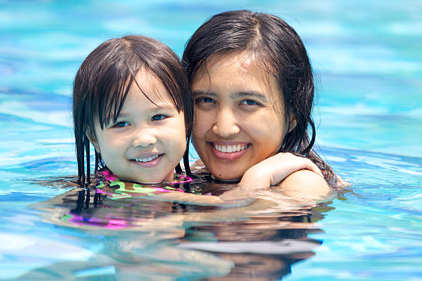 istock Mother Swimming With Her Daughter 515469586