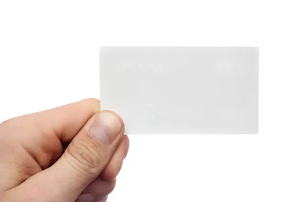 Photo of Men's  hand holds business card on white background