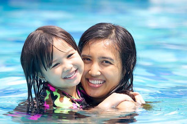 istock Mother Swimming With Her Daughter 515471408