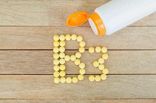 istock Yellow pills forming shape to B3 alphabet on wood background 515474202