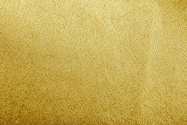 istock Golden paper foil on background texture. 515475842