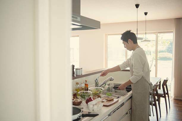 istock Man washing the dishes in the kitchen 515477794