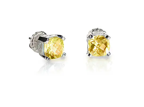 Yellow diamond citrine topaz stud earrings pair isolated on white