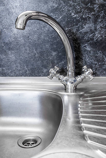 istock Kitchen faucet and sink close up 515479954