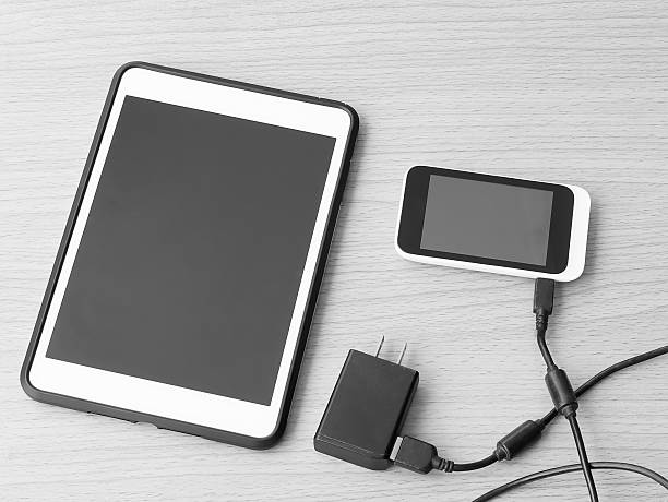 istock Black and White digital tablet and smartphone on wooden 515483888